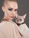 Beautiful woman with Sphynx cat