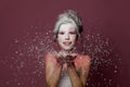 Beautiful woman with stage makeup and white snow on colorful pink background. Winter party, Halloween carnival and theater Royalty Free Stock Photo