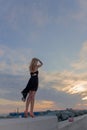 Beautiful woman standing blue sky sunset