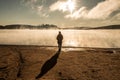 Beautiful woman standing lake of two rivers algonquin national park Canada look sunrise mist in the fog clouded swamp Royalty Free Stock Photo