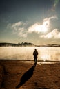 Beautiful woman standing lake of two rivers algonquin national park Canada look sunrise mist in the fog clouded swamp Royalty Free Stock Photo