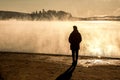 Beautiful woman standing lake of two rivers algonquin national park Canada look sunrise mist in the fog clouded swamp Royalty Free Stock Photo