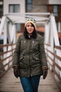 Beautiful woman standing on a wooden bridge Royalty Free Stock Photo