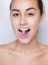 Beautiful woman sticking out her tongue and showing young piercing Royalty Free Stock Photo