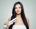 Beautiful woman with straight hair and curly hair using hair straightener. Cute girl straightening healthy hair with flat iron.