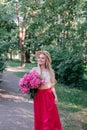 Beautiful woman in straw hat with peony flowers outdoor Royalty Free Stock Photo