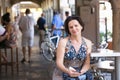 Beautiful woman in a street cafe at a table. Royalty Free Stock Photo