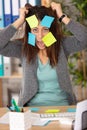 beautiful woman with stress and post it papers Royalty Free Stock Photo
