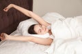 Beautiful woman stretching with pleasure in bed Royalty Free Stock Photo