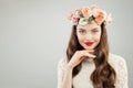 Beautiful woman in summer flowers wreath. Pretty model with red lips makeup and cute smile portrait Royalty Free Stock Photo