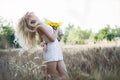 Beautiful woman between sunflower Royalty Free Stock Photo