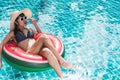 Beautiful woman sunglasses bikini in ring float inflatable watermelon Royalty Free Stock Photo