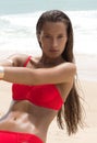 Beautiful woman in sunglasses and red bikini on beach. Fashion look. lady Royalty Free Stock Photo