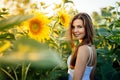 Beautiful woman surrounded by sunflowers Royalty Free Stock Photo