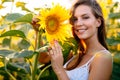 Beautiful woman surrounded by sunflowers Royalty Free Stock Photo