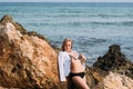 Beautiful woman in swimsuit on coastline, Gozo