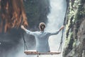 Beautiful woman swings near waterfall in the jungle of Bali island, Indonesia. Royalty Free Stock Photo