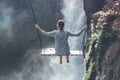 Beautiful woman swings near waterfall in the jungle of Bali island, Indonesia. Royalty Free Stock Photo