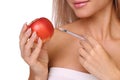 Beautiful woman with syringe of red vaccine dose inject on apple. Royalty Free Stock Photo