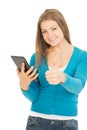 Beautiful woman with tablet shows thumb up