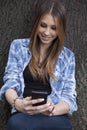 Beautiful woman taking a photo with her smart phone Royalty Free Stock Photo