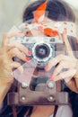 Beautiful woman taking photo with old fashioned film camera Royalty Free Stock Photo