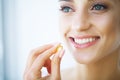 Beautiful Woman Taking Pill, Medicine. Vitamins And Supplements Royalty Free Stock Photo