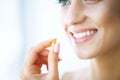 Beautiful Woman Taking Pill, Medicine. Vitamins And Supplements Royalty Free Stock Photo