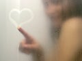 Beautiful woman taking a shower. Royalty Free Stock Photo