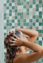 Beautiful woman taking shower in her bathroom. Royalty Free Stock Photo