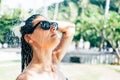 Beautiful woman taking shower near the pool Royalty Free Stock Photo