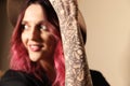Beautiful woman with tattoos on arm against background, focus on hand