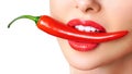 Beautiful woman teeth eating red hot chili pepper Royalty Free Stock Photo