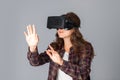 Beautiful woman testing virtual reality helmet Royalty Free Stock Photo