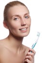 Beautiful woman with toothbrush. Dental care background. Closeup on young woman showing toothbrush. Beautiful young woman