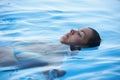 Beautiful Woman tourist in infinity pool Royalty Free Stock Photo