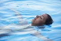 Beautiful Woman tourist in infinity pool Royalty Free Stock Photo