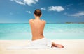 Beautiful woman in towel with bare back on beach Royalty Free Stock Photo