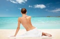 Beautiful woman in towel with bare top on beach Royalty Free Stock Photo