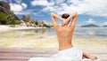 Beautiful woman in towel with bare top on beach Royalty Free Stock Photo