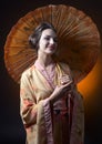 Beautiful woman in traditional japanese kimono with umbrella Royalty Free Stock Photo