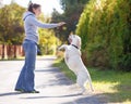 Beautiful woman training dog