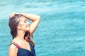 Beautiful woman on tropical beach, Brunette tanned girl enjoying and walking on beach Royalty Free Stock Photo