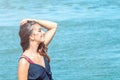 Beautiful woman on tropical beach, Brunette tanned girl enjoying and walking on beach Royalty Free Stock Photo