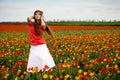 Beautiful woman in tulips field