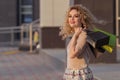 Beautiful woman turning around and smiling with shopping bags. happy girl with their purchases. Royalty Free Stock Photo