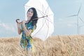Beautiful woman with umbrella in the Rye Royalty Free Stock Photo