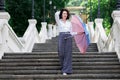 Beautiful woman umbrella urban staircase outdoor park Royalty Free Stock Photo