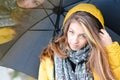 Beautiful woman umbrella in warm yellow coat Royalty Free Stock Photo