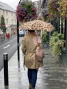 Beautiful woman under umbrella in Ireand